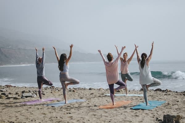 Future of wellness - beach yoga - Leo Carillo, United States